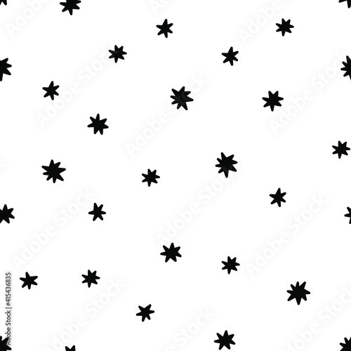 Doodle stars seamless pattern. Chaotic black stars isolated on white background. © Elena
