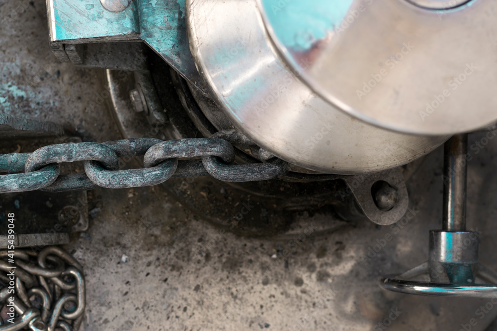 Vessel chain close up on windlass anchor winch capstan Vessel chain close up on windlass anchor winch capstan