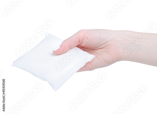Sanitary napkin menstruation in hand on white background isolation