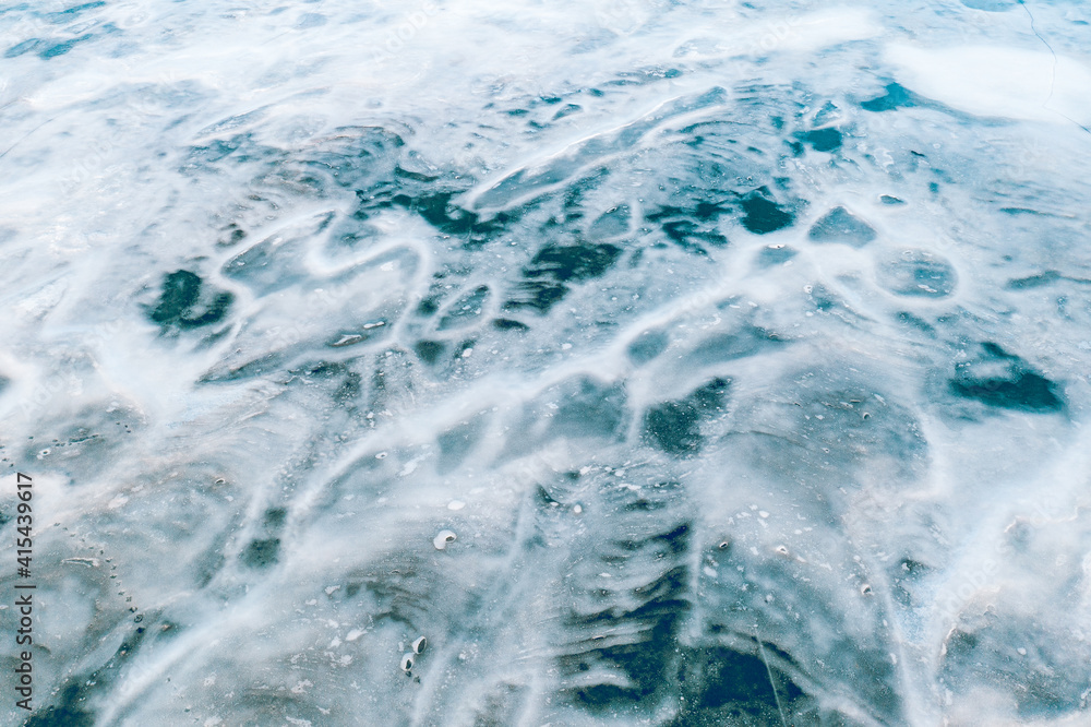 Aerial view of frozen lake. Ice from drone view. Winter landscape with clear smooth ice. Aerial view of frozen lake. Ice from drone view. Winter landscape with clear smooth ice.