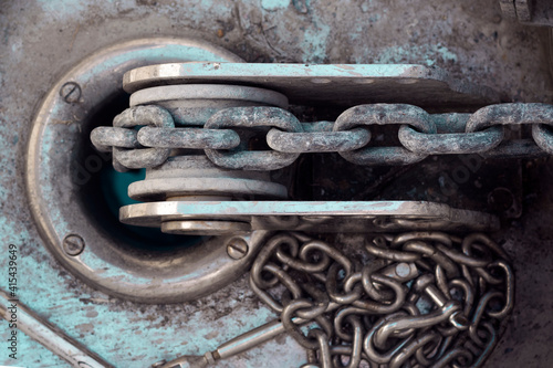 Vessel chain close up on windlass anchor winch capstan