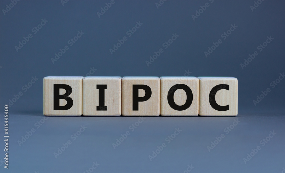 BIPOC symbol. Abbreviation BIPOC, black, indigenous and people of color on wooden cubes. Beautiful grey background. Copy space. Business and BIPOC, black, indigenous and people of color concept. BIPOC symbol. Abbreviation BIPOC, black, indigenous and people of color on wooden cubes. Beautiful grey background. Copy space. Business and BIPOC, black, indigenous and people of color concept.