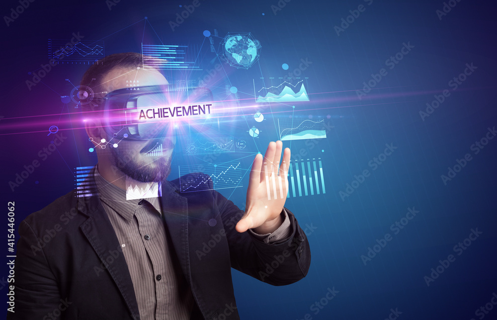 Businessman looking through Virtual Reality glasses with ACHIEVEMENT inscription, new business concept Businessman looking through Virtual Reality glasses with ACHIEVEMENT inscription, new business concept