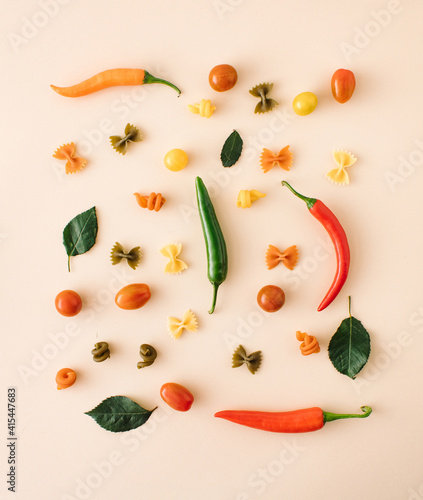 Italian pasta, various shapes with fresh juicy vegetables and spices. chilli pappers, tomato. creative cooking. healthy cooking.