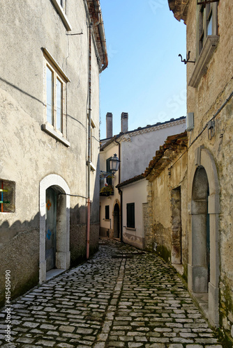 Fototapeta Naklejka Na Ścianę i Meble -  An alley between the old stone houses of Sassinoro, a medieval village in the province of Benevento.