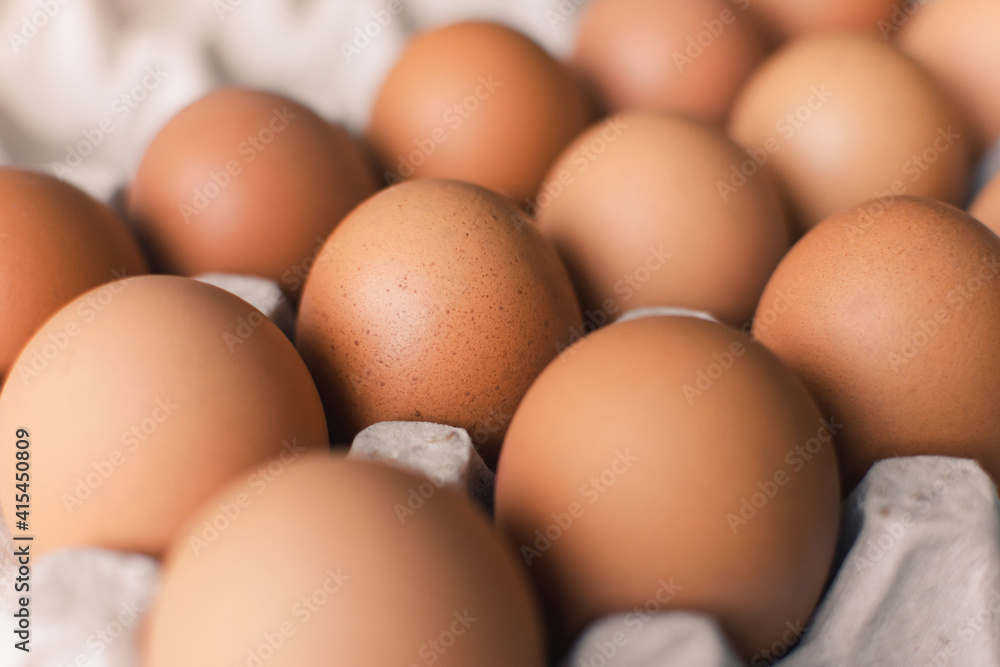 Chicken eggs in a carton box. Raw chicken eggs. Chicken eggs in a carton box. Raw chicken eggs.