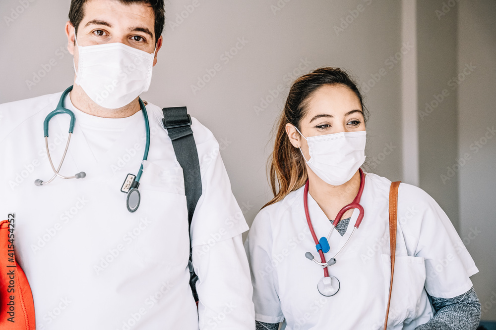 Doctors in medical mask standing in hospital Doctors in medical mask standing in hospital