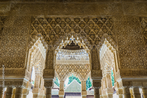 details of the arabesque decorations, typical of the moorish architecture than can be found in the Nasrid palaces of the Alhambra complex in Granada (Spain)