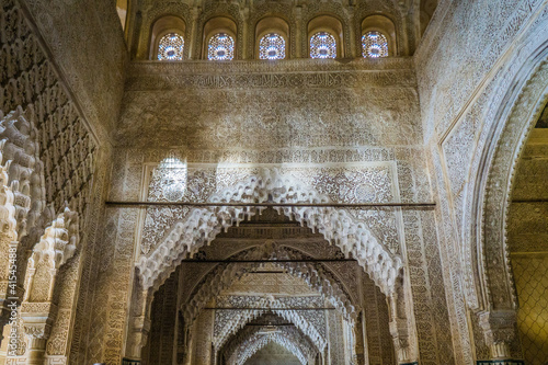 details of the arabesque decorations, typical of the moorish architecture than can be found in the Nasrid palaces of the Alhambra complex in Granada (Spain)