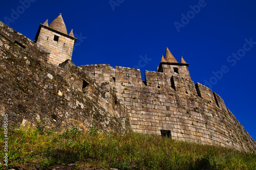 Vista de las torres, murallas y demás elementos arquitectónicos del castillo portugués de Santa Maria da Feira photo