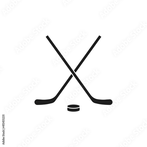 Crossed hockey sticks and puck icon. Vector. Flat design. Isolated.	