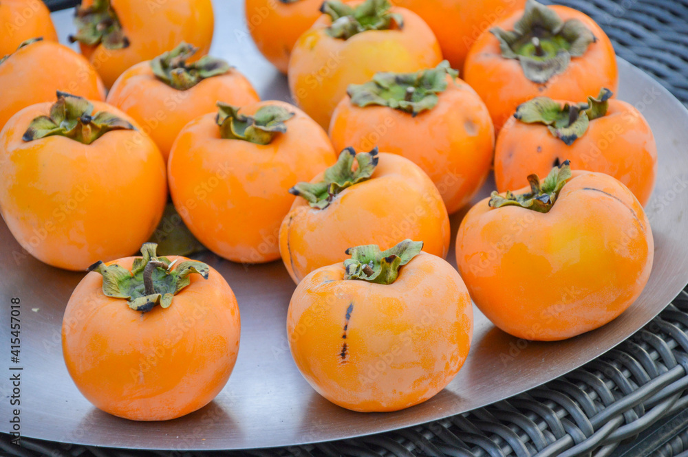 Fresh kaki persimmons just from the garden Fresh kaki persimmons just from the garden