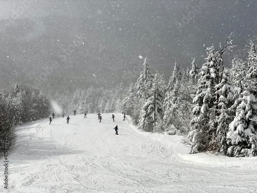 Beautiful day at Okemo mountain with fresh snow and panoramic views in Vermont USA photo