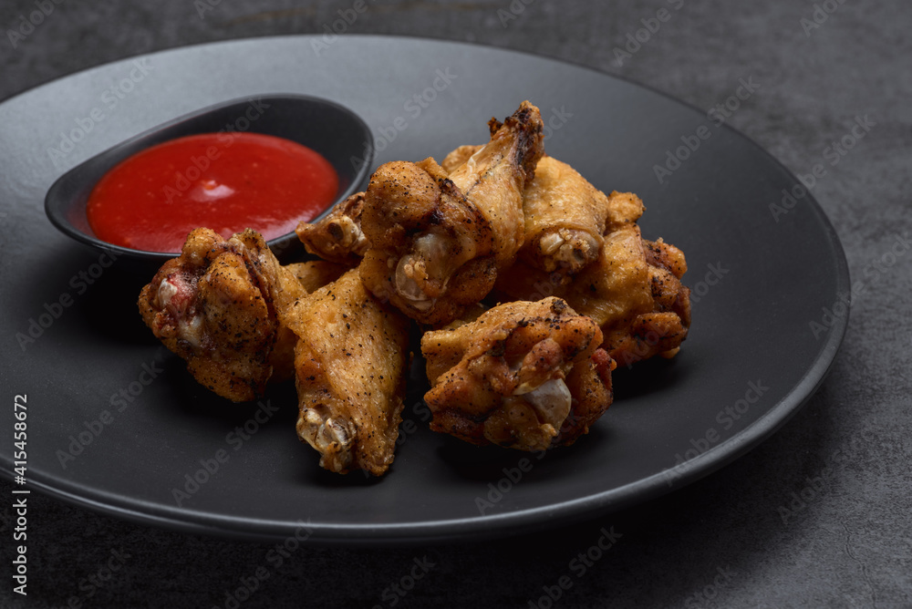 Spicy chicken wings in spicy spices, BBQ sauce Spicy chicken wings in spicy spices, BBQ sauce