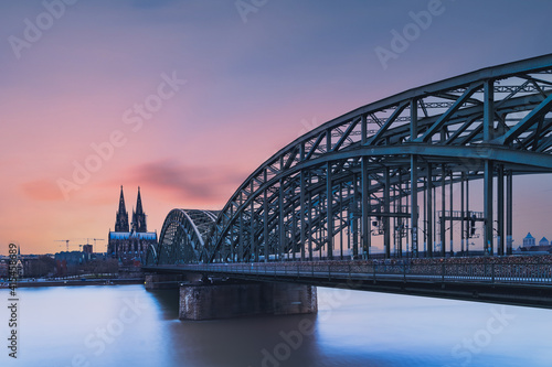 Hohenzollern Bridge over the Rhine River and Cologne Cathedral on sunset  © Masood