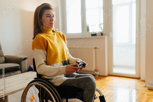 Female in wheelchair playing video games