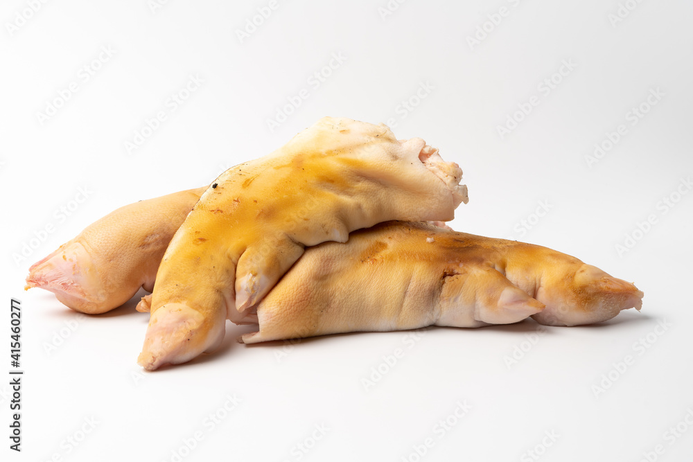Half-raw pig’s feet on a pure white background Stock Photo | Adobe Stock