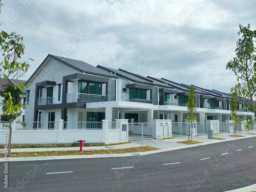 Fototapeta Naklejka Na Ścianę i Meble -  SEREMBAN, MALAYSIA -APRIL 15, 2020: New double story luxury terrace house under construction in Malaysia.  Designed by an architect with a modern and contemporary style.
