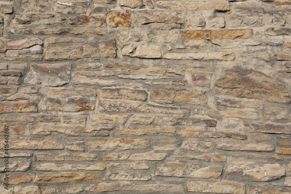 Weathered wall from wild stones, retro surface Weathered wall from wild stones, retro surface