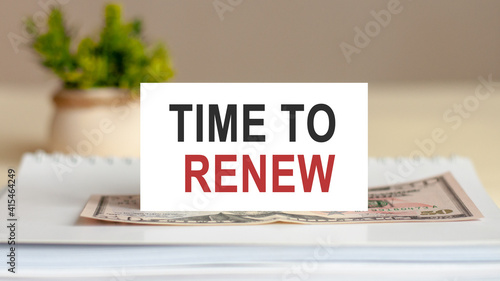 Text note - TIME TO RENEW on white paper card, business concept photo