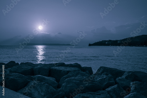 cold blue sunset at the sea horizon
