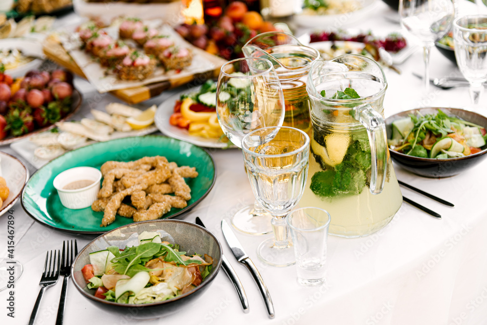 Festive table full of delicious food and snacks, beautiful serving, catering,lemonade Festive table full of delicious food and snacks, beautiful serving, catering,lemonade