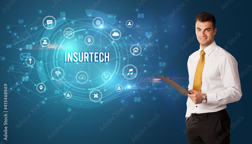 Businessman thinking in front of technology related icons and INSURTECH inscription, modern technology concept Businessman thinking in front of technology related icons and INSURTECH inscription, modern technology concept