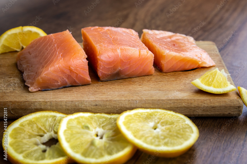 Raw salmon fish fillet with lemon