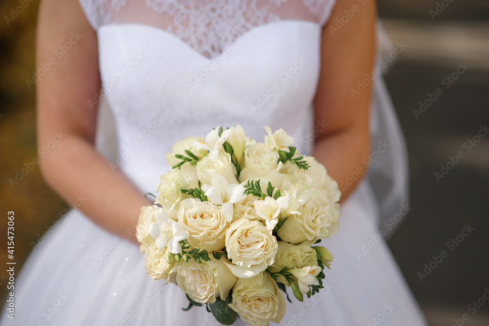 Beautiful wedding bouquet in hands of the bride. Rose, cotton, roses. Pink, white and Peach. Trendy and modern wedding flowers. Soft pastels. Beautiful wedding bouquet in hands of the bride. Rose, cotton, roses. Pink, white and Peach. Trendy and modern wedding flowers. Soft pastels.