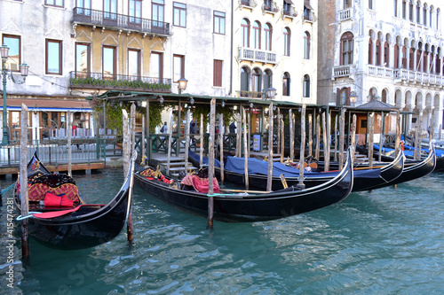 Typical view of the Venetian canal with gondolas and old houses.  © Svetlana