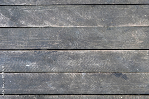 old dusty gray wooden plank wall. horizontal lines. rough surface texture