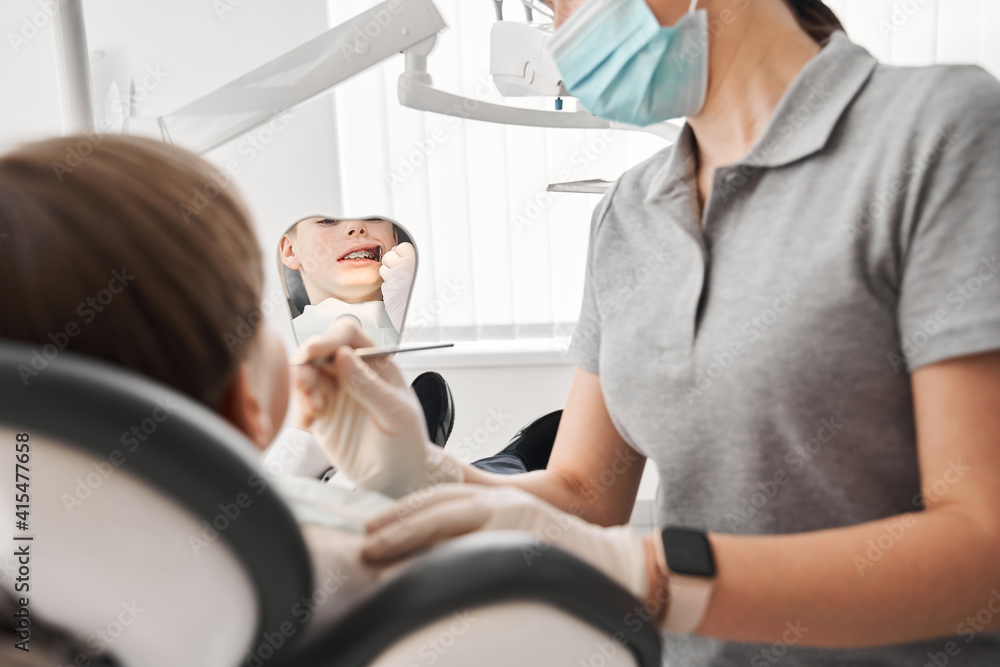 Obraz premium Patient with braces during a regular orthodontic visit