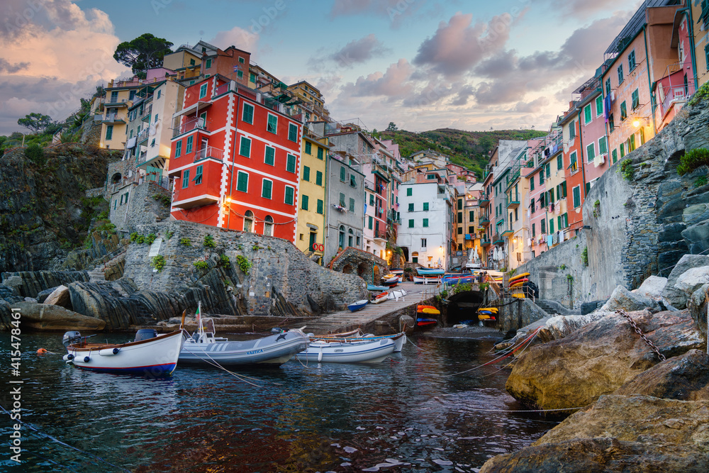 Riomaggiore the village and comune in the province of La Spezia, situated in a small valley in the Liguria region of Italy. Sunrise over the beautiful harbour in the fishing village.