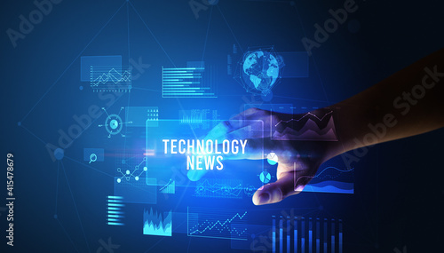 Hand touching TECHNOLOGY NEWS inscription, new business technology concept