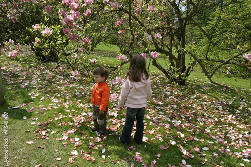 Children under a blooming apple tree