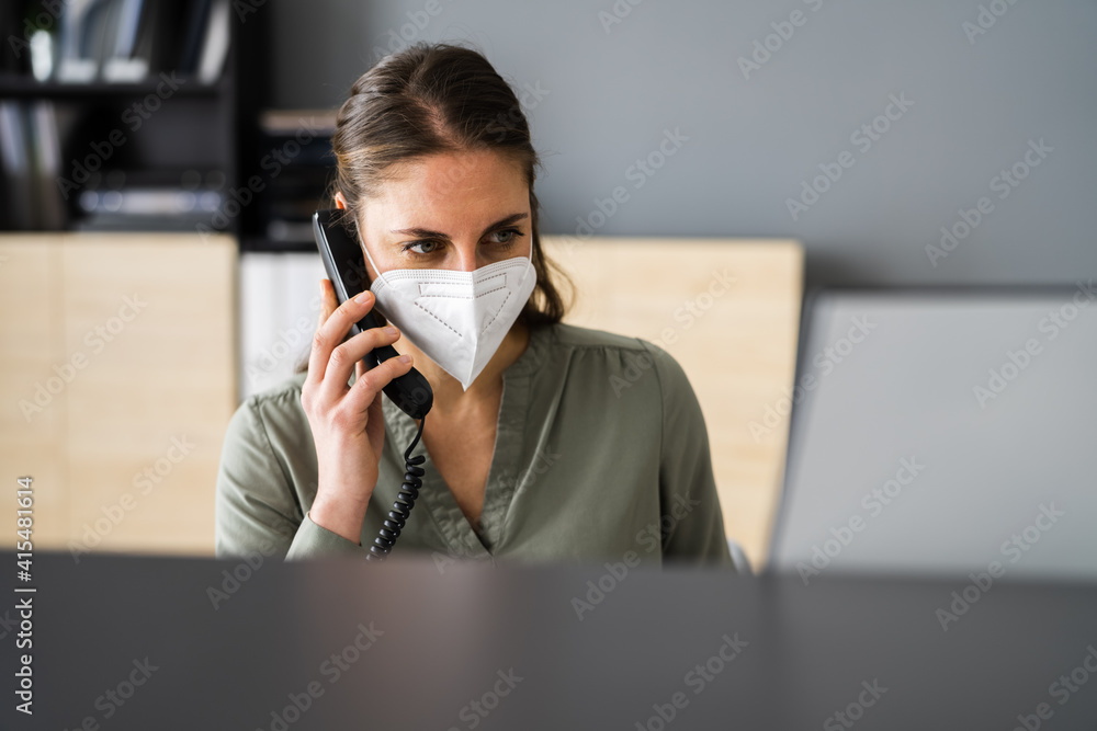 Receptionist On Phone Wearing Face Mask Receptionist On Phone Wearing Face Mask