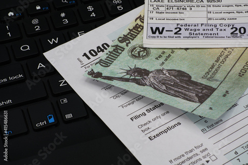 US IRS Internal Revenue Service income tax filing form 1040 with supporting documents.