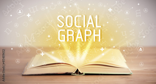 Open book with SOCIAL GRAPH inscription, social media concept