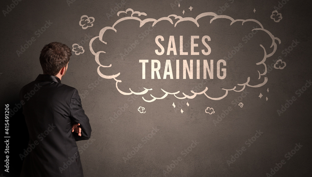 businessman drawing a cloud with SALES TRAINING inscription inside, modern business concept