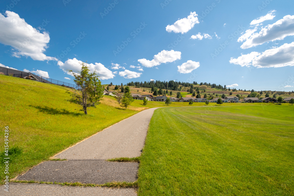 A wide community park and lawn in a new home, hillside subdivision outside of Spokane Washington, USA