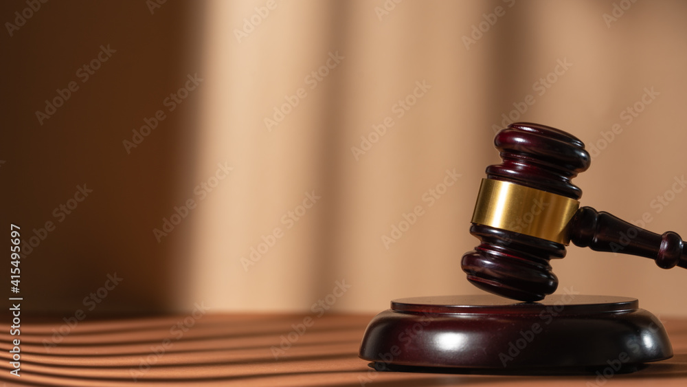 Judge gavel on a homogeneous background Justice and injustice, law Judge gavel on a homogeneous background Justice and injustice, law