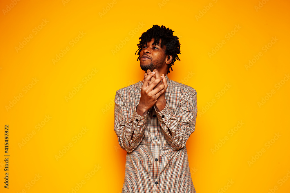young handsome african american guy student posing cheerful and gesturing on yellow background, lifestyle people concept young handsome african american guy student posing cheerful and gesturing on yellow background, lifestyle people concept