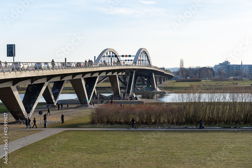 Dresden spring season at the Waldschlösschen Bridge. A lot of people are walking around at the Elbe river banks and enjoying the nature. © 1take1shot