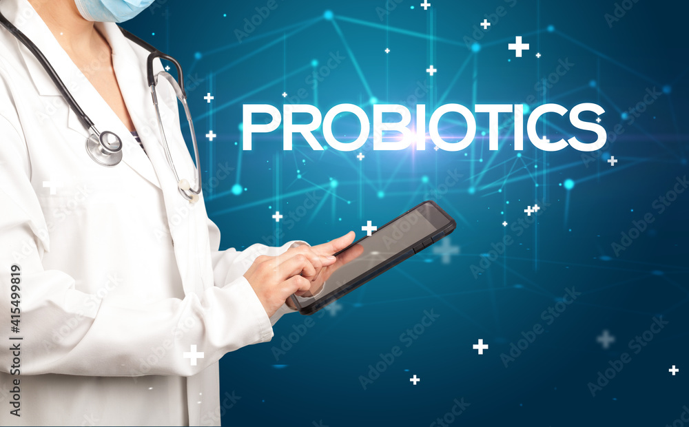 Doctor fills out medical record with PROBIOTICS inscription, medical concept Doctor fills out medical record with PROBIOTICS inscription, medical concept