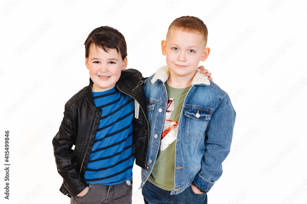 two little boys embrace brotherly and smile. Two happy children two little boys embrace brotherly and smile. Two happy children
