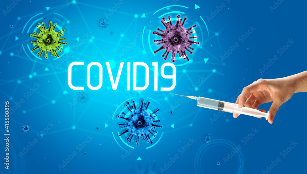 Syringe, medical injection in hand with COVID19 inscription, coronavirus vaccine concept Syringe, medical injection in hand with COVID19 inscription, coronavirus vaccine concept