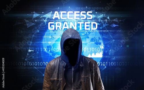 Faceless hacker at work with ACCESS GRANTED inscription, Computer security concept