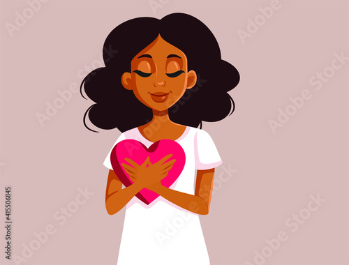 African Woman Holding a Big Heart Symbol