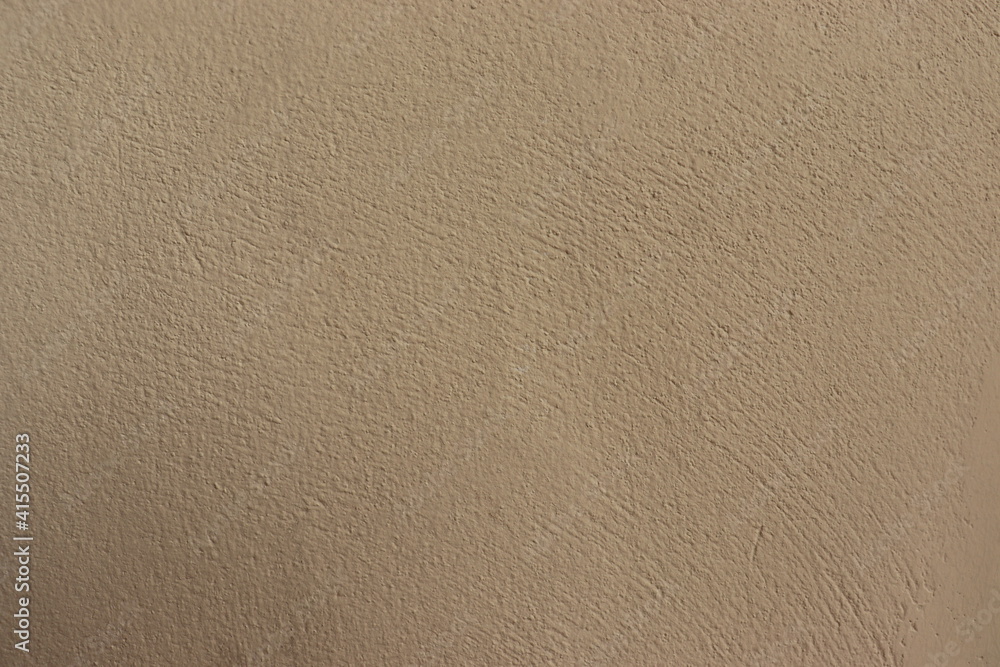 The walls are made of cream stucco, with a rough and rough surface. There is a blank space for the text. Ideas for background. The walls are made of cream stucco, with a rough and rough surface. There is a blank space for the text. Ideas for background.