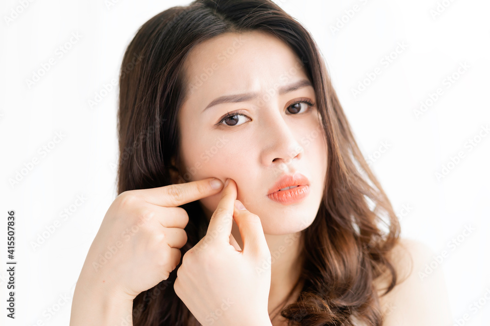 Asian woman sitting makeup in front of mirror Asian woman sitting makeup in front of mirror